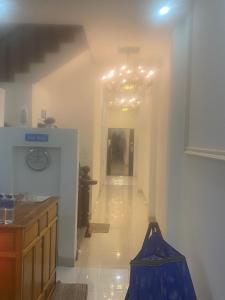 a kitchen with a hallway with a chandelier at Khách Sạn Bình Minh 