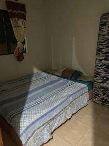 a small bedroom with a bed in the corner at Residencia Yiriy in Capitán Miranda