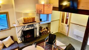 an overhead view of a living room with a fireplace at Tanglewood in Dinner Plain