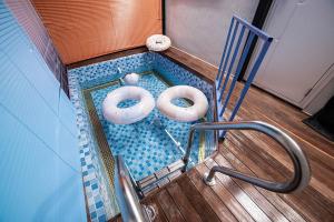 a miniature swimming pool with two donuts in it at Hamdeok Poolvilla Pension Lamborghini in Jeju +58 photos