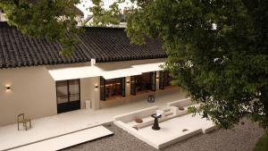 an overhead view of a white building with a black roof at songzhiyu3平江路 in Suzhou
