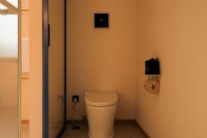 a bathroom with a white toilet in a room at songzhiyu3平江路 in Suzhou +22 photos