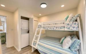 a bedroom with two bunk beds in a room at JDH Beachfront Retreat in Ocean City