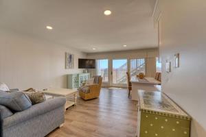 a living room with a couch and a table at JDH Beachfront Retreat in Ocean City