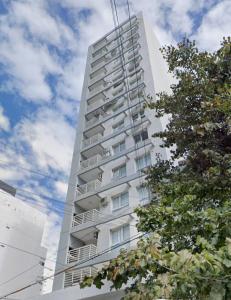 a tall white apartment building with balconies on it at Saavedra - Hermoso y con cochera opcional in Santa Fe
