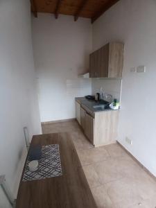 a kitchen with a sink and a counter top at Departamento castillo in Pilar