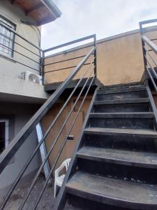 a set of stairs in front of a building at Departamento castillo in Pilar