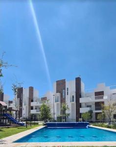 an empty swimming pool in front of a building at In Zire, a beautiful, fully-equipped rest house in Cedro