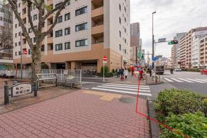 a city street with a crosswalk and a crosswalk at Akihabara Skytree Premium Apartment 302 in Tokyo