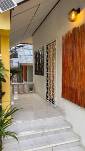 an open door to a building with a patio at Friends Retreat Phuket in Ban Bo Han