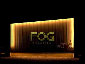 a sign that says fg with a yellow light at FOG villa&spa in Kirishima
