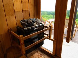 a pile of coal sitting next to a window at FOG villa&spa in Kirishima +54 photos