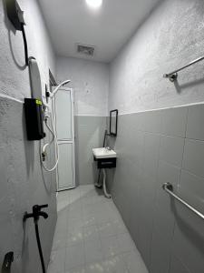 a small bathroom with a sink and a shower at MAMAB SMART HOME STUDIO HOMESTAY - Tepi Highway Melor in Kota Bharu