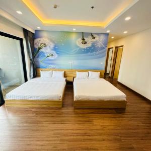 Katil atau katil-katil dalam bilik di FLC Three Bedroom Apartment Quy Nhon