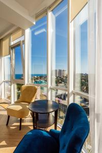 a living room with a view of the city at Gagarin Plaza Apartment in Odesa