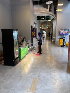 a child is standing in a hallway in a mall at B residence apartment BSD cozy and nice in Tjilandak