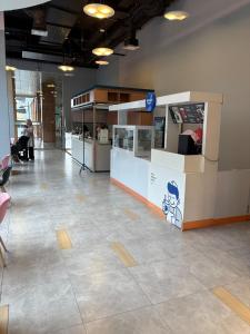 a lobby with a counter in a building at B residence apartment BSD cozy and nice in Tjilandak +27 photos