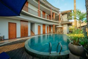 a swimming pool in the middle of a house at ODA Guest House Umalas in Kerobokan +41 photos