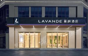 a store front with a sign that reads la lamande at 麗枫酒店广州番禺汉溪长隆大石地铁站店 in Guangzhou +3 photos