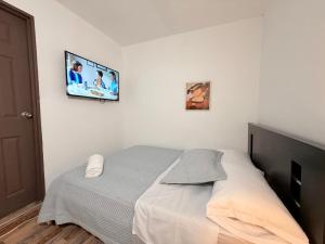 Ένα ή περισσότερα κρεβάτια σε δωμάτιο στο Lofthouse 14 +41 φωτογραφίες