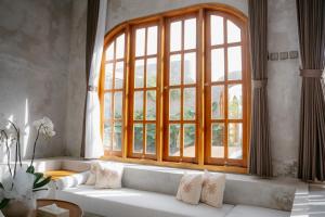 Postel nebo postele na pokoji v ubytování Dharman Royal Villas