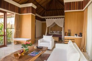 Χώρος καθιστικού στο Komaneka at Rasa Sayang Ubud