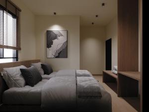 een woonkamer met een bed en een bank bij Blenz Hotel in Serdang