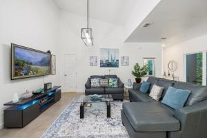 a living room with a couch and a tv at 3BR lovely Townhouse in McAllen in McAllen