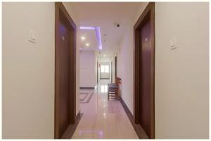 a hallway with two doors leading to a room at Hotel Imperial Nayna Near the mall road - Naini Lake - Best Budget Hotel in Nainital