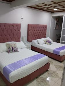 Postel nebo postele na pokoji v ubytování Encantadoras Habitaciones Privadas Del Valle