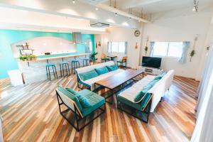 a living room with a couch and a table at Small Resort 志摩 in Shima
