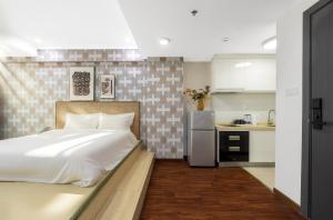 Η κουζίνα ή μικρή κουζίνα στο Vanhome Serviced Apartment 梵宿公寓