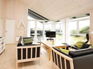 a living room with a couch and a table at Luxury Beach House in Blokhus - By Traum Ferienwohnungen in Blokhus
