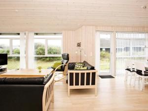 a living room with a couch and a table at Luxury Beach House in Blokhus - By Traum Ferienwohnungen in Blokhus