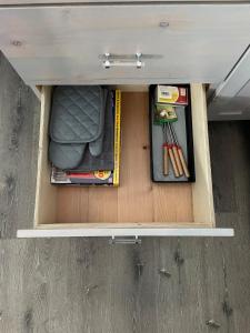 a drawer in a van with various items in it at Denim and Diamonds in Cane Beds +23 photos