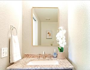 a bathroom with a sink and a mirror at Perfect Escape with Epic Views in Tucson