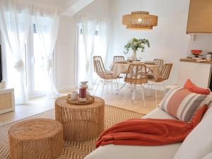 a living room with a table and a couch at Apartamento Larrabide Boho Chic in Pamplona +39 photos