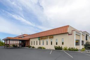 a building with a parking lot in front of it at Quality Inn Kenai in Kenai