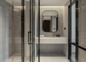 a bathroom with a sink and a mirror at The28 Residence in Hanoi +51 photos