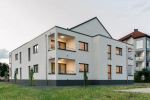 an exterior view of a white building at Business and Family Homes in Burgau