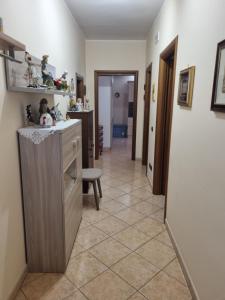 a hallway of a home with a counter and a room at La perla marina in Cellole
