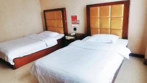 Katil atau katil-katil dalam bilik di Binhao Hotel