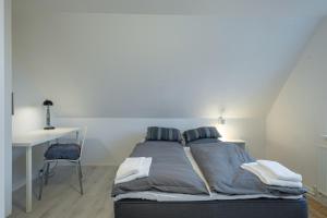 Postel nebo postele na pokoji v ubytování Scandinavian Charm in Aalborg
