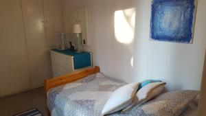 A bed or beds in a room at Seafront Villa Aggeliki