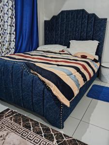 Postel nebo postele na pokoji v ubytování BR Homes Bungoma