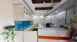an office with a desk with a window on the wall at Serdang Business Hotel in Kuala Lumpur