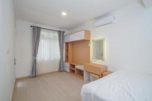 Postel nebo postele na pokoji v ubytování Villa Ixora Resort + 29 fotografií