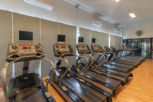 a row of cardio machines in a gym at Elegant and Modern Home at Sansaran Villa Chiang Mai in Ban Phae Khwang
