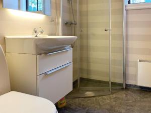 a bathroom with a sink and a shower at 4 person holiday home in Holsljunga in Holsljunga +19 photos