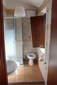 a bathroom with a toilet and a sink at Ali House in Montecorvino Rovella